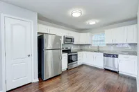 Clean lines and modern finishes bring new life to this updated kitchen—complete with sleek cabinetry and stainless steel appliances.
