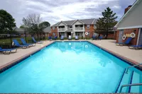 A refreshing escape just steps from home — Hamilton Station’s pool area features a spacious sundeck, plenty of lounge chairs, and scenic views of the community’s apartment buildings.