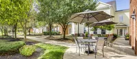 From patio to pathway: step right into the courtyard and enjoy a peaceful stroll under the trees, just beyond your favorite outdoor hangout.