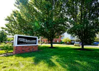 Our monument sign welcomes you under the shade of mature trees, with home just steps away.