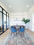 Welcoming, calm, and easy to navigate — just like the rest of Camden Park. Elegant office space with modern decor, featuring stylish blue chairs, a sleek wooden desk, and vibrant plants, creating a refreshing and professional ambiance.