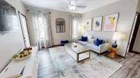The Hub includes a a spacious living room with natural light and private patio/balcony access.