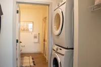 Your Nese apartment features an in-unit washer and dryer integrated into a modern space.