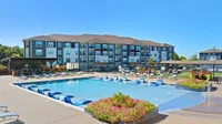 Take a refreshing dip or simply relax by the water on the sundeck or the adjoining outdoor kitchen.