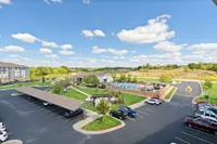 Our community amenities provide plenty of room to relax, including our outdoor lounge, green spaces, and the pool.