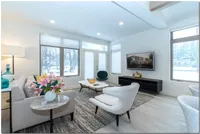 Bright and Open Livingroom Area, with High Ceilings that are Cable and Internet Ready.