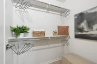 Spacious walk-in closet with built-in shelving