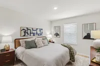 Spacious primary suite with plenty of room for a king-size bed and more