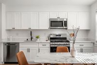 Open concept kitchen with sleek appliances