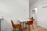 Modern dining table with leather dining chairs