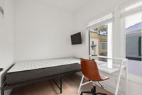 Single bed room with natural lighting