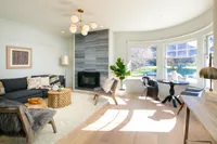 Bright, modern living area with bay windows