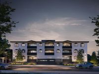Modern apartment building exterior at dusk, featuring unique architectural design with illuminated windows and sleek balconies.