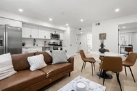 Open concept living room, kitchen and dining area