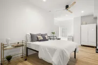 Fully furnished bedrooms include a bed, closet, microwave and refrigerator.