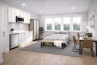 Modern studio apartment with cozy bedroom, stylish kitchenette, and bright work area featuring large windows and chic decor.