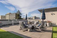 Luxurious rooftop terrace featuring stylish seating, modern decor, and breathtaking city views, perfect for relaxation and entertaining.
