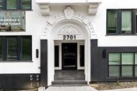 Elegant apartment entrance with ornate arch and modern design at 2701, inviting you to schedule a tour today.