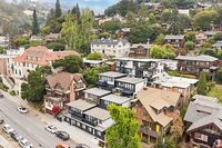 Charming hillside neighborhood with modern townhouses and lush greenery, offering a serene living environment.