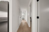 Hallway from communal space to bedrooms.