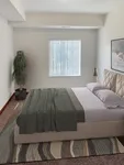 Elegant bedroom with a cozy bed, stylish decor, and natural light filtering through a window for a serene atmosphere.