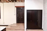 Inviting apartment entryway with warm wood accents, contemporary double doors, and a sleek closet for optimal storage.
