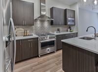 Experience elegance in this penthouse with upgraded kitchen appliances, including 36" Bertazzoni range, designed for style and functionality.