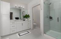 Experience elegance in this modern bathroom with a private water closet, offering a blend of functionality and style.