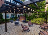 Relax in style in our secure, private outdoor patio, featuring ambient lighting and a cozy fireplace.