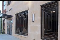 Elegant entrance to private parking and convenience of secure building access with wheelchair accessibility.