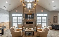 Experience premium living in our clubhouse lounge, perfect for relaxation and entertainment. Elegant apartment lounge with cozy armchairs, modern fireplace, and large chandelier, perfect for relaxation and gatherings.