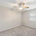 Experience the inviting warmth and spacious design of this cozy room.