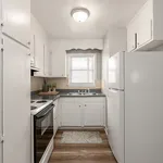 Experience culinary delight in this cozy and well-lit kitchen space.