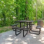 Relax in this tranquil outdoor setting, perfect for picnics and enjoying nature.