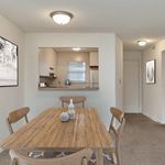 Experience the seamless connection between the dining area and kitchen in this stylish apartment.