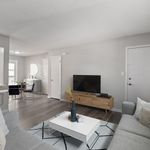 Experience the elegance of urban living with this sophisticated and comfortable living room setup.