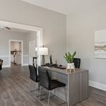 Step into a beautifully designed office space, seamlessly transitioning into a chic kitchen.