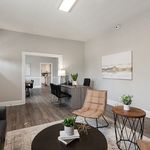 Explore this sophisticated living room designed for comfort and style, perfect for both work and relaxation.