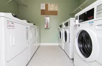 Modern laundry room equipped with efficient washers and dryers, perfect for convenient apartment living.