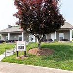 Inviting leasing center with charming landscaping and modern brick exterior, perfect for welcoming new tenants.