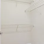 Spacious and versatile walk-in closet with sturdy wire shelves, ideal for organized storage and maximizing space.