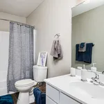 Chic bathroom with modern fixtures, a sleek vanity, and soothing blue accents creating a tranquil retreat.
