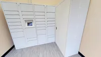 State-of-the-art package locker station with sleek white design, offering secure and convenient parcel storage.