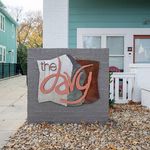 Charming apartment entrance featuring a stylish sign for 'The Davy' with modern design elements.