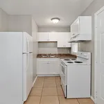 Charming kitchen with modern white cabinetry, sleek countertops, and energy-efficient appliances.