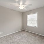 Bright, airy room with soft carpet and large window, perfect for enhancing your home with abundant natural light.