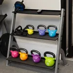Modern fitness corner with a sleek kettlebell rack showcasing a vibrant collection of weights for a dynamic workout space.