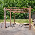 Inviting outdoor carport with wooden pergola design in a lush green setting, perfect for summer shade and style.