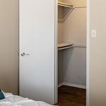 Inviting walk-in closet with ample storage space, perfect for organizing your wardrobe in style.
