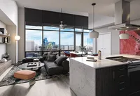 Modern apartment living room with floor-to-ceiling windows, city views, sleek kitchen island, and stylish decor.